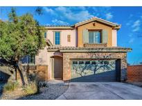 Two-story house with stone accents and a two-car garage at 9494 Stillwater Bend Ln, Las Vegas, NV 89178