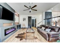 Spacious living room featuring a fireplace and modern decor at 1717 Imperial Cup Dr, Las Vegas, NV 89117