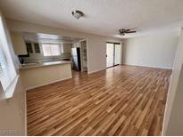 Spacious living room with laminate flooring and access to a patio at 1963 Scimitar Dr # 0, Henderson, NV 89014