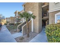 Tan two-story building with stairs and walkway at 2900 Sunridge Heights Pkwy # 1514, Henderson, NV 89052