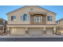 Tan two-story home with three-car garage and balcony at 3309 Jamaica Princess Pl # 3, North Las Vegas, NV 89084