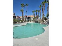 Community pool with lounge chairs and a spa at 8600 W Charleston Blvd # 1129, Las Vegas, NV 89117