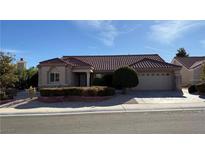 Single-story home with stone accents and a tile roof at 8821 Sandspring Dr, Las Vegas, NV 89134