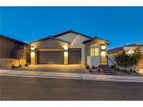 Stunning curb appeal with a two-car garage and well-manicured landscaping at 11870 Star Grass Ave, Las Vegas, NV 89138