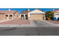 One-story house with a two-car garage and desert landscaping at 162 Windy Creek Ave, Las Vegas, NV 89123