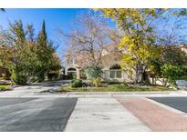 Beautiful two-story home with landscaping and a large driveway at 2469 Sun Reef Rd, Las Vegas, NV 89128