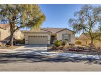 Single-story house with a two-car garage and landscaped front yard at 2707 White Sage Dr, Henderson, NV 89052