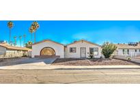 Ranch style home with carport and landscaped yard at 3091 Liberty Cir, Las Vegas, NV 89121