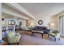 Bright living room with comfy seating and a view into the dining area at 3760 Desert Marina Dr # 67, Laughlin, NV 89029