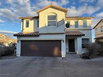 Two-story house with brown garage door and neutral color exterior at 8237 New Leaf Ave, Las Vegas, NV 89131