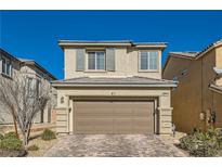 Two-story house with a two-car garage and a landscaped front yard at 8272 Southern Cross Ave, Las Vegas, NV 89131