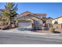 Two-story house with stone accents and a two-car garage at 185 Rocky Star St, Henderson, NV 89012