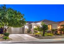 Charming single-story home with a well-manicured front yard and a two-car garage at 2336 Indigo Island St, Henderson, NV 89044