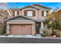 Two-story house with brown siding, neutral accents, and a two-car garage at 7234 Regent Pond St, Las Vegas, NV 89166