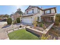 Charming two-story home with well-manicured landscaping and a spacious two car garage at 11015 Dornoch Castle St, Las Vegas, NV 89141