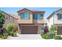 Two-story home with attractive landscaping and a two-car garage at 12461 Mosticone Way, Las Vegas, NV 89141