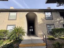 Exterior view of the apartment building showing the entrance and landscaping at 2606 S Durango Dr # 171, Las Vegas, NV 89117