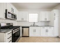 Modern kitchen featuring stainless steel appliances and white cabinetry at 5420 Tinker Toy Ave, Las Vegas, NV 89139