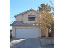 Two-story house with attached garage and landscaping at 5466 Silverheart Ave, Las Vegas, NV 89142