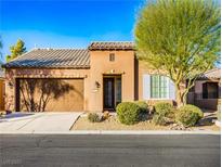 Single-story home with front yard landscaping and a two-car garage at 5625 Galivan Vista St, North Las Vegas, NV 89081