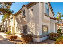 Well-maintained stucco building with walkway and landscaping at 1671 Normandy Way # 611, Henderson, NV 89014