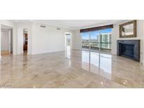 Bright living room with fireplace and city views at 2777 Paradise Rd # 3401, Las Vegas, NV 89109