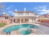 Two-story house with a sparkling pool and covered patio at 3755 Broadmead St, Las Vegas, NV 89147