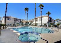 Community pool and spa with surrounding patio furniture at 5100 Jordan Frey St # 203, Las Vegas, NV 89130