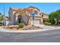 Two-story house with attached garage and landscaping at 5728 Blizzard Breeze St, North Las Vegas, NV 89081