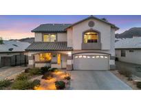 Two-story house with landscaped yard, walkway, and attached garage at 781 Wigan Pier Dr, Henderson, NV 89002