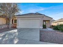 Single-story home with attached garage and landscaped front yard at 2073 Desert Woods Dr, Henderson, NV 89012