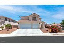 Two-story house with a two-car garage and landscaped front yard at 5396 Valley Wells Way, Las Vegas, NV 89113