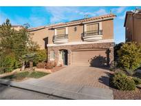 Two-story house with attached garage and landscaped front yard at 5956 Lambert Bridge Ave, Las Vegas, NV 89139