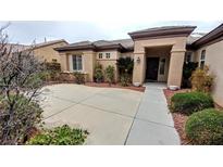 Single-story home with front yard landscaping and a paved walkway to the entrance at 2554 Highmore Ave, Henderson, NV 89052
