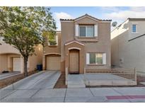 Charming two-story home featuring a cozy front porch, neutral stucco facade, and attached one car garage at 6233 Chert Ave, Las Vegas, NV 89139