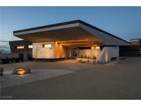 Modern home with sleek design, angular roofline, and landscaped entry at 705 Dragon Peak Dr, Henderson, NV 89012
