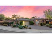Charming single-story home with well-manicured landscaping and attached two-car garage at 23 Feather Sound Dr, Henderson, NV 89052