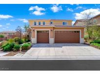 Exterior features a two-car garage, well maintained yard, and a traditional design at 917 Old Creek Way, North Las Vegas, NV 89084