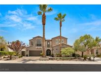 Two-story house with a three-car garage and palm trees in the front yard at 2904 Evening Rock St, Las Vegas, NV 89135