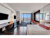 Modern bedroom with city views and comfortable bed at 4381 W Flamingo Rd # 3309, Las Vegas, NV 89103