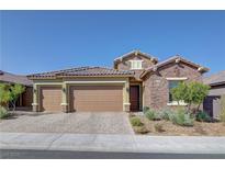 Single-story home with a two-car garage and desert landscaping at 2527 Speyburn Ave, Henderson, NV 89044