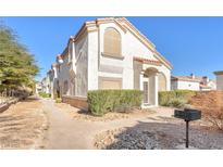 Two story house with front yard landscaping, walkway, and grill at 355 Seine Way # 1412, Henderson, NV 89014