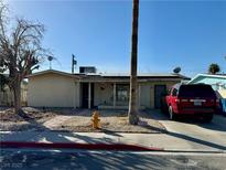 Ranch style home with carport and landscaped front yard at 4911 Lana Dr, Las Vegas, NV 89121