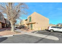 Tan two-story building with parking and landscaping at 5945 Vegas Dr, Las Vegas, NV 89108