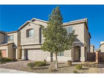 Two-story house with a landscaped front yard and attached garage at 7716 Gallego Plains Dr, Las Vegas, NV 89113