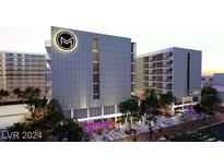 Modern multi-story building with retail space and sleek design at 924 S First St # 406, Las Vegas, NV 89101
