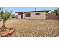 Modest single story home featuring low maintenance landscaping and a neutral exterior paint scheme at 111 Manganese St, Henderson, NV 89015
