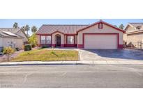 Single-story house with a two-car garage and well-maintained lawn at 2613 Nobility Ave, North Las Vegas, NV 89032