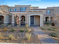 Two-story home with attractive landscaping and a paved walkway at 3206 Brynley Ave, Henderson, NV 89044