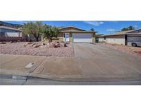 Charming single-story home featuring a two-car garage, desert landscaping, and a well-maintained front yard at 458 Crestway Rd, Henderson, NV 89015
